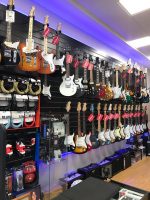 B sharp Music Wall of Electric Guitars